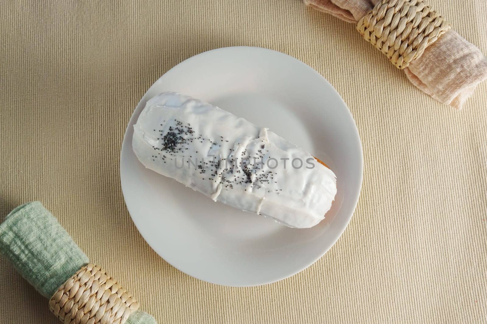 Donut with luscious frosting sits atop a pristine white plate, showcasing the perfect balance of flavors. by darksoul72
