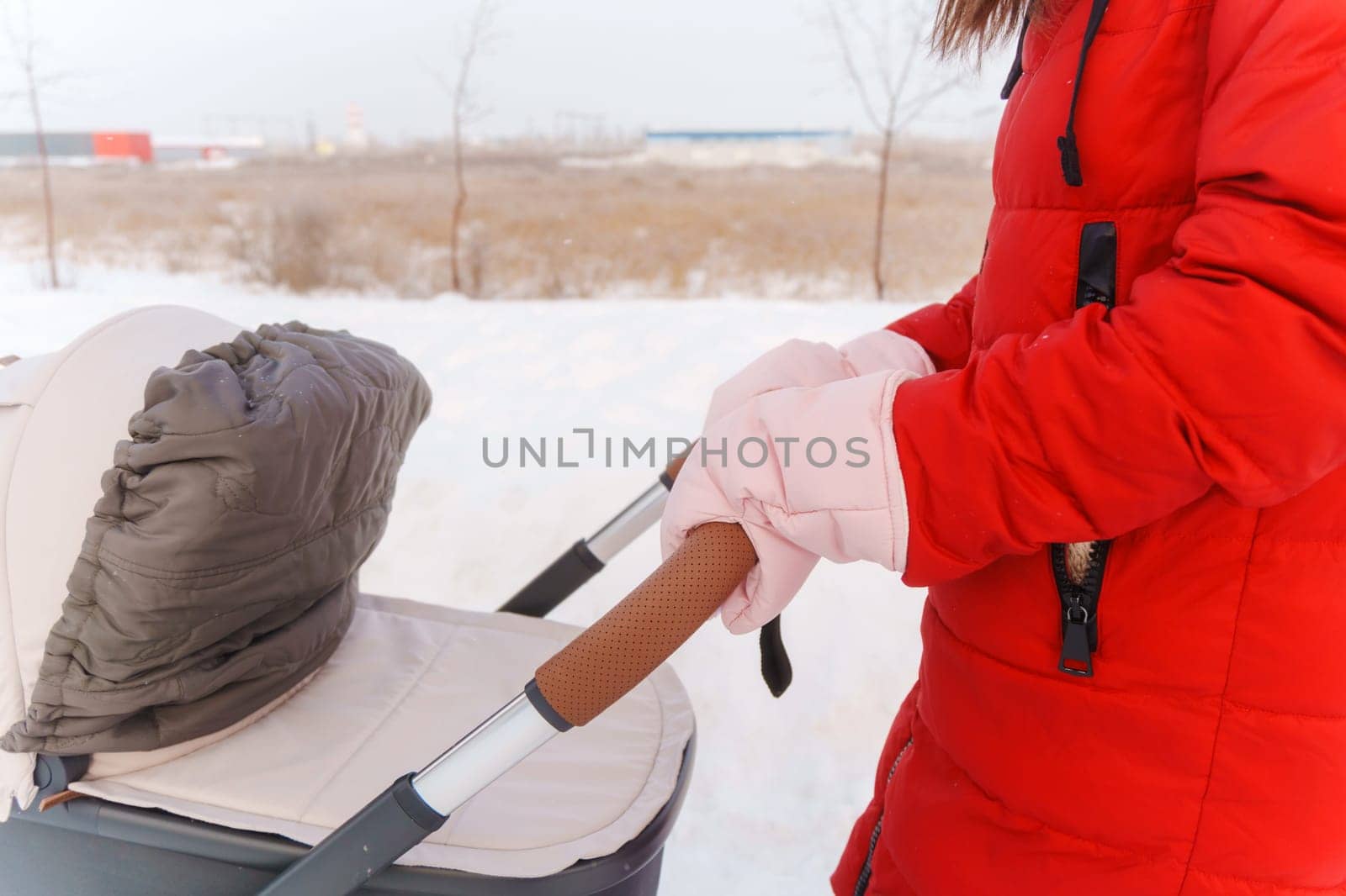 Winters Tender Care: A Mothers Walk With Her Child in the Snow