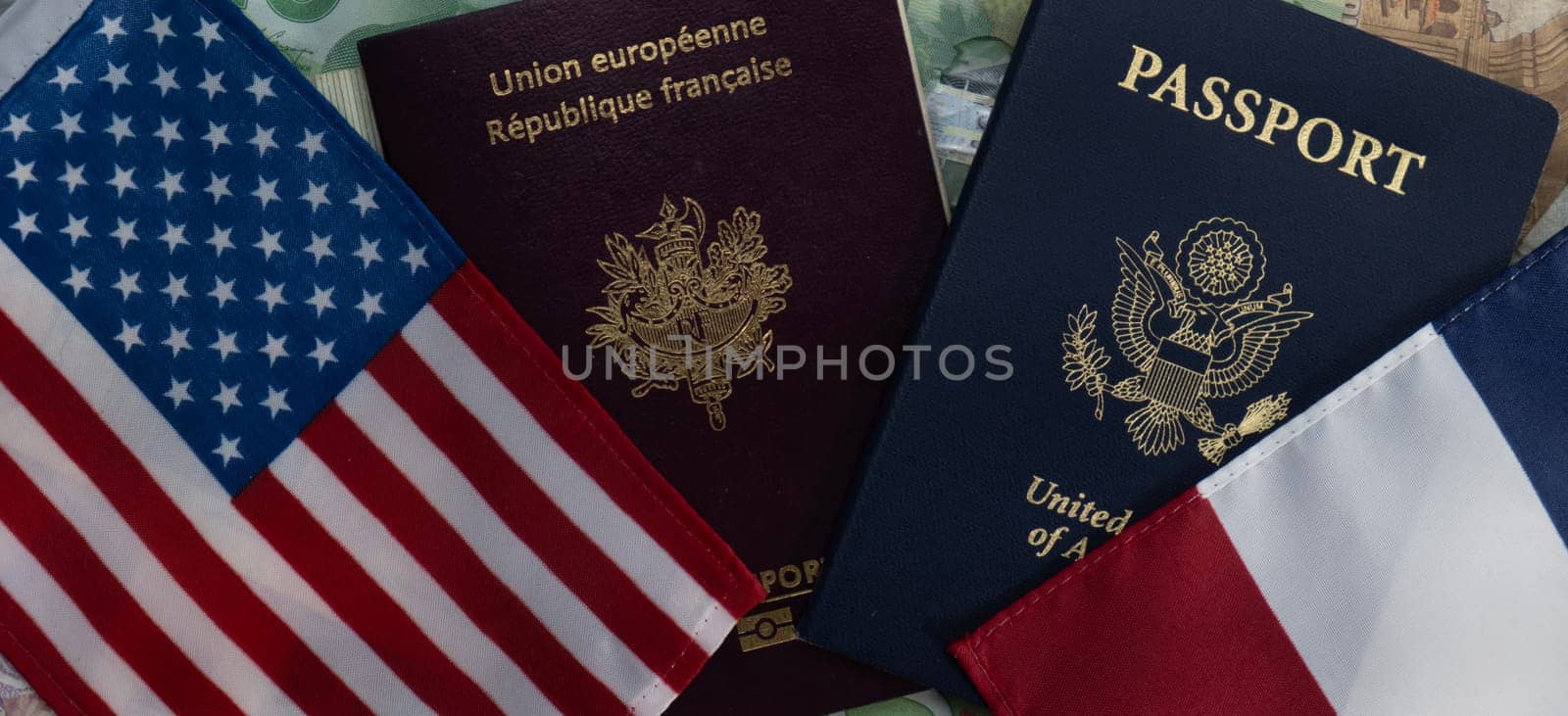 Flags of the United States and France passports on currency flat lay. Concept of business, trade, employment, vacation travel. Concept coming summer Olympics. Closeup, selective focus photo high quality photo.