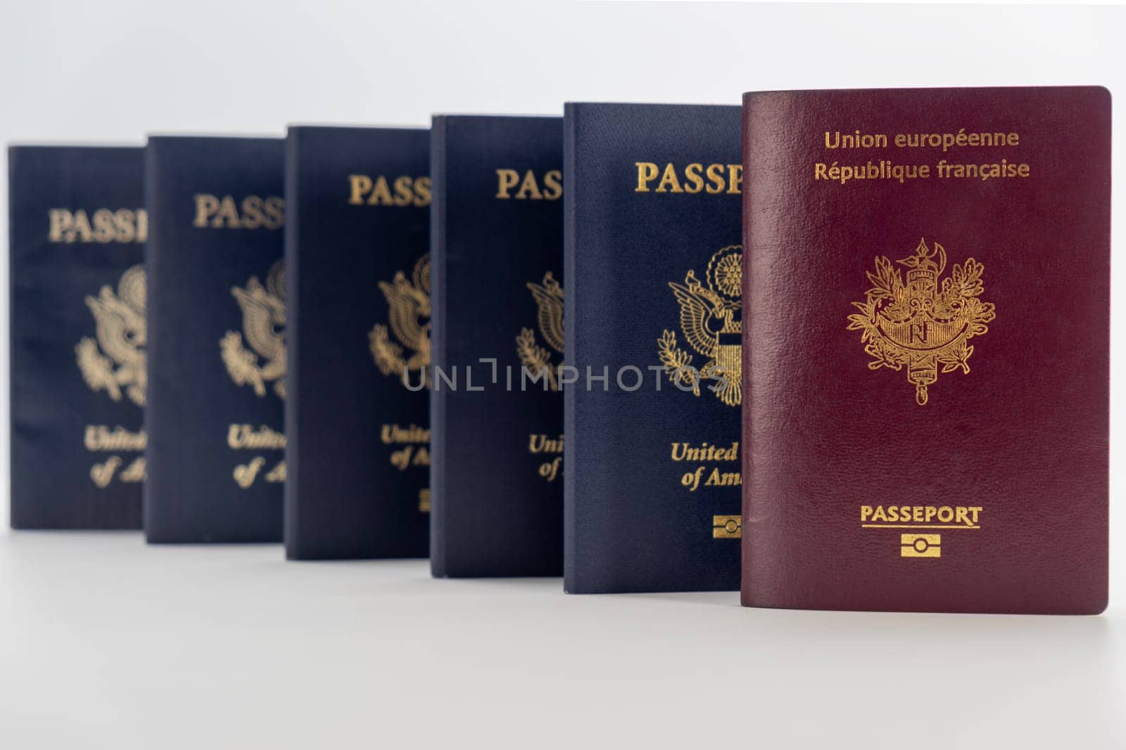 1 France 5 United States passports transparent background, prespective camera angle by bRollGO