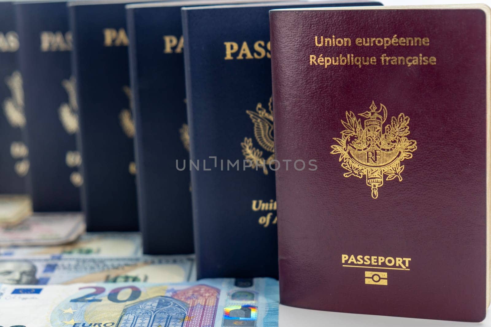 United States and France passports on currency transparent background, low camera angle by bRollGO