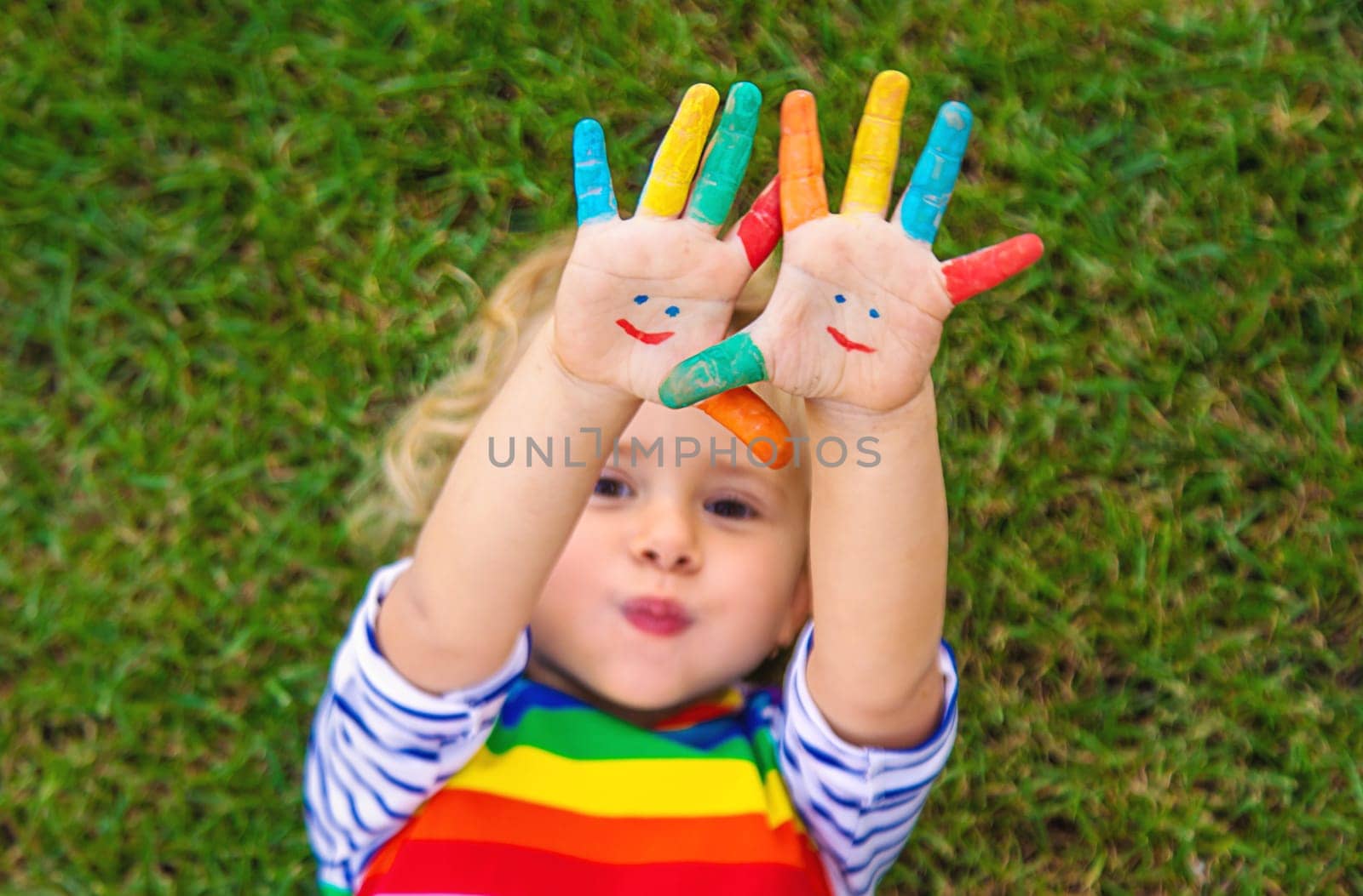Child in hand draw smile. Selective focus. by yanadjana