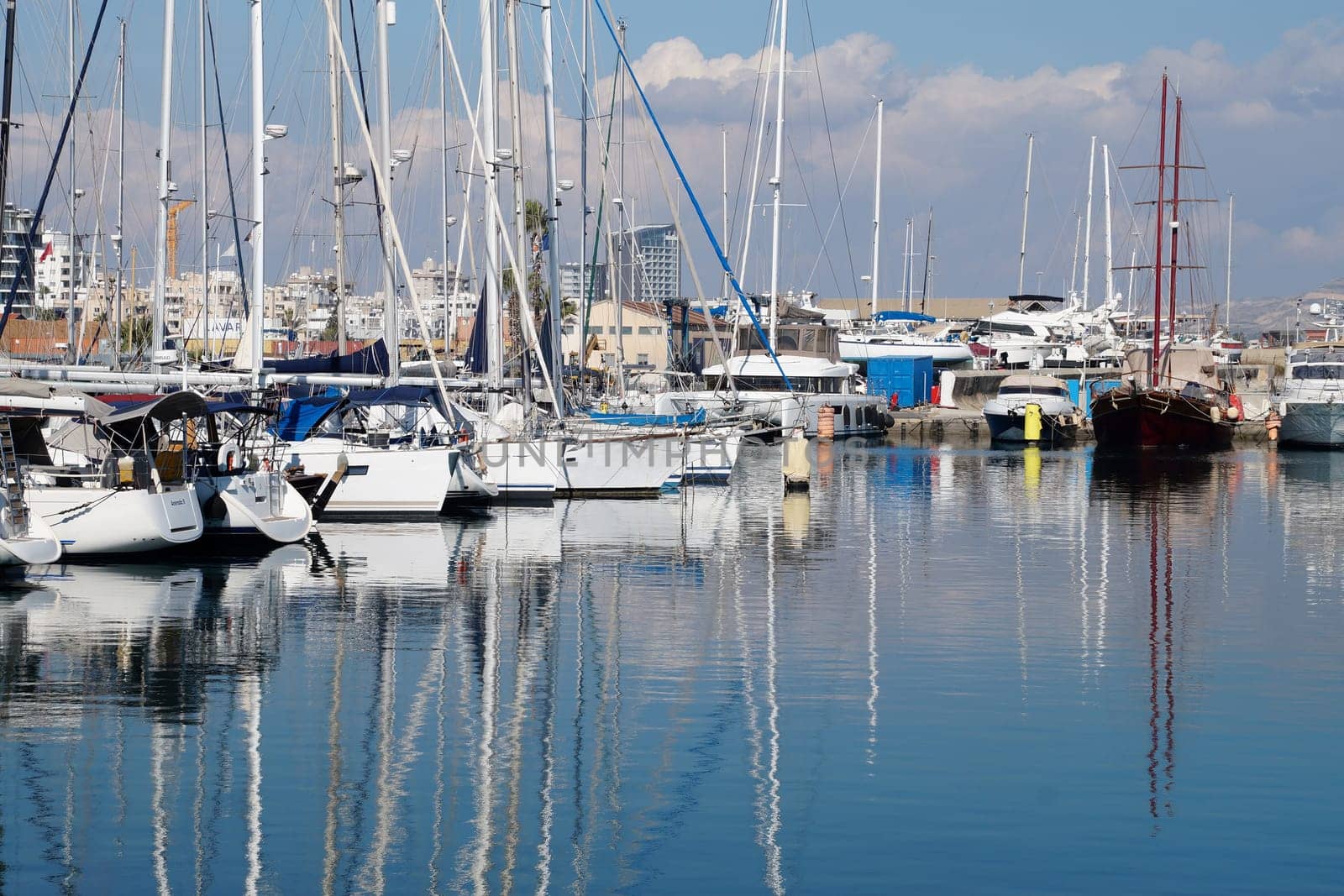 seaport of Larnaca with moored yachts on a sunny day by Annado
