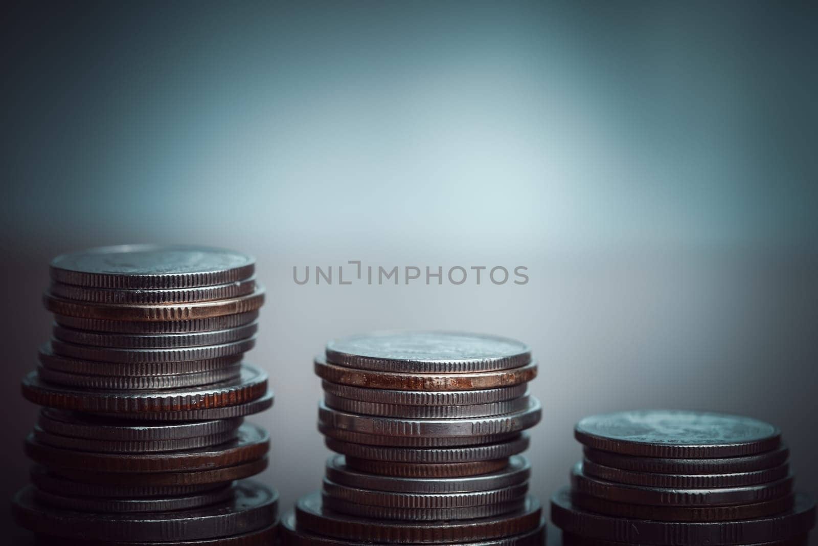 Stack of coins with filter effect retro vintage style and shallow depth of field, representing financial value, savings, or investment, and symbolizing prosperity or economic stability.