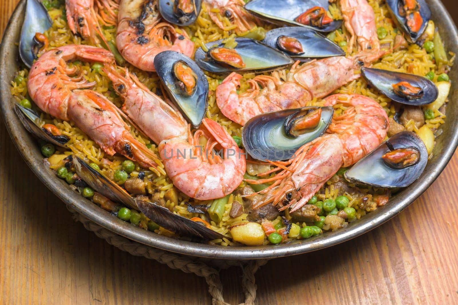 Brightly colored seafood paella presented in a traditional pan, typical Spanish cuisine, Majorca, Balearic Islands, Spain,