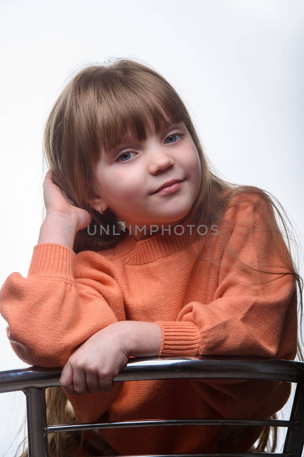 studio portrait of a charming little girl on a white background 3