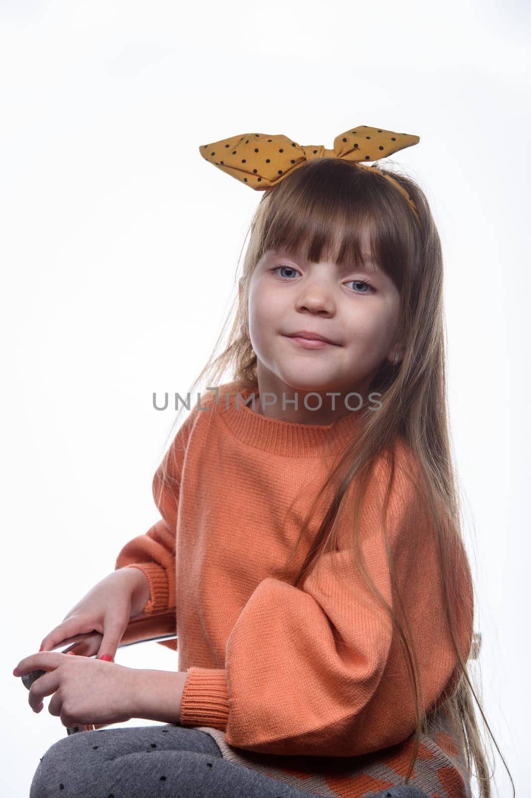 studio portrait of a charming little girl on a white background 7