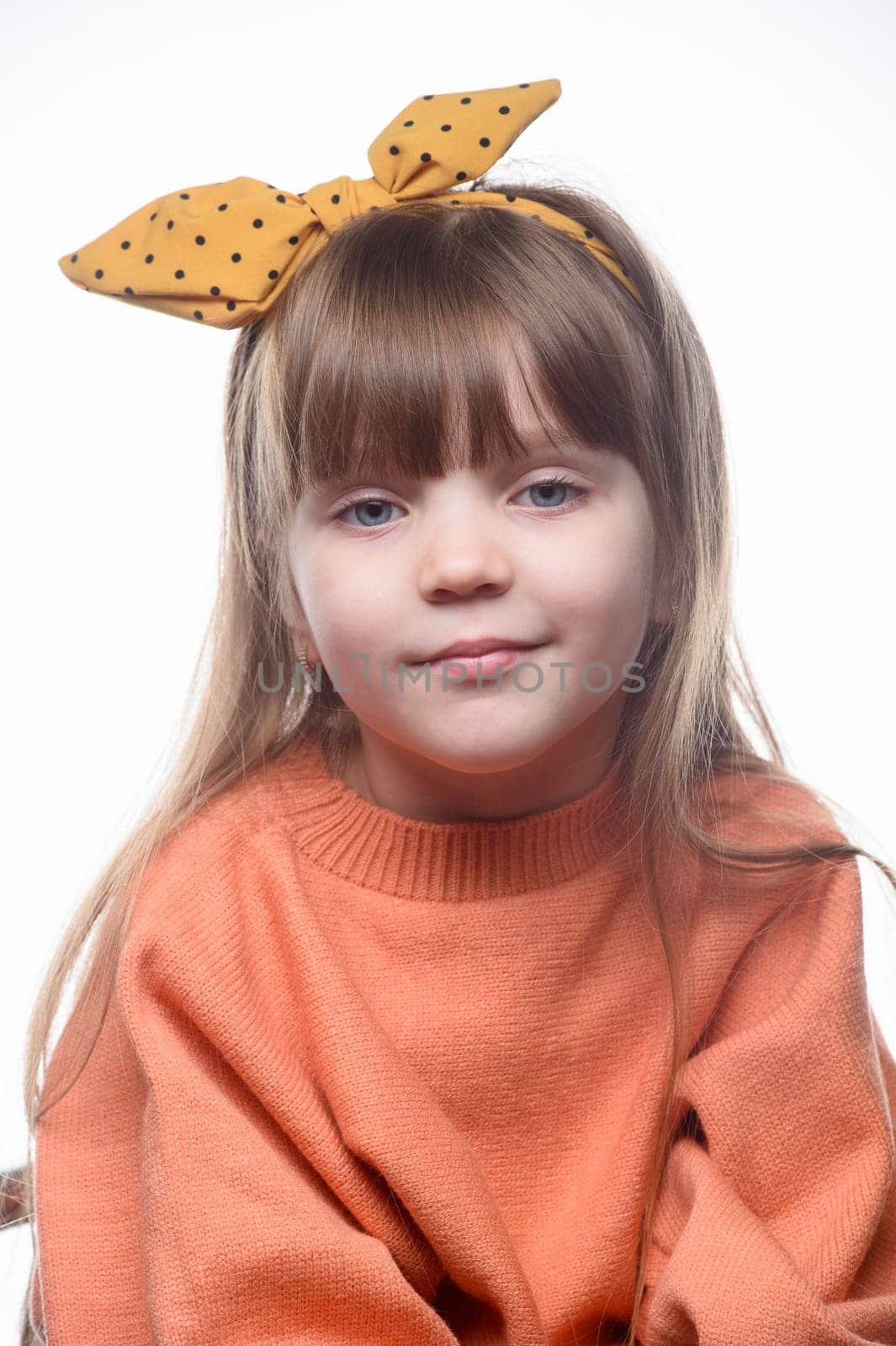 studio portrait of a charming little girl on a white background 8