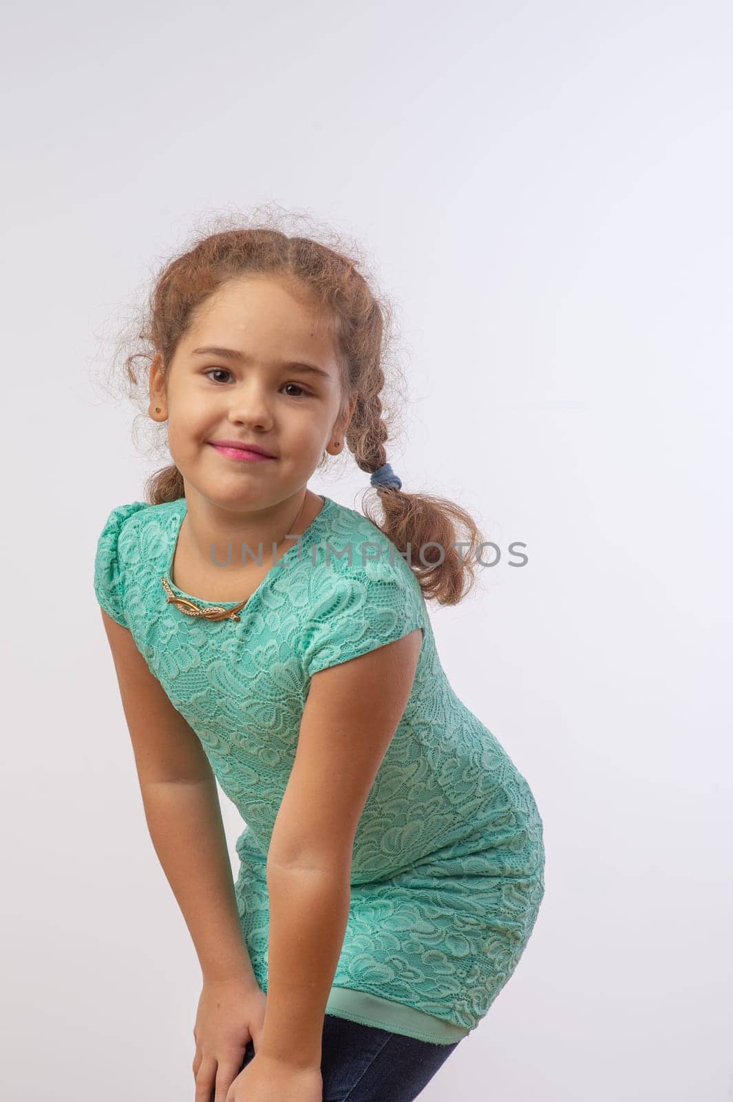 studio portrait of a charming little girl on a white background 12