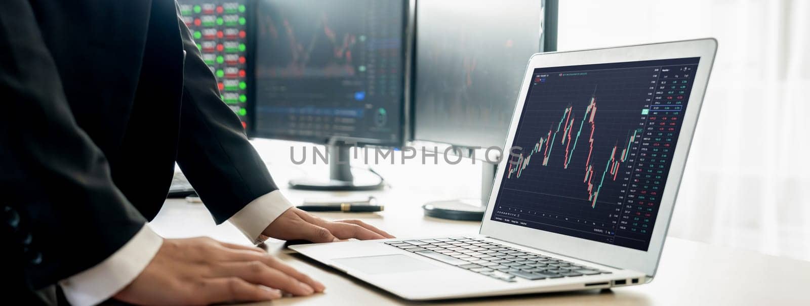 Cropped image of group of expert professional treader discuss about stock market graph show increasing graph while point on the computer display at office. Money exchange, growth chart. Burgeoning.