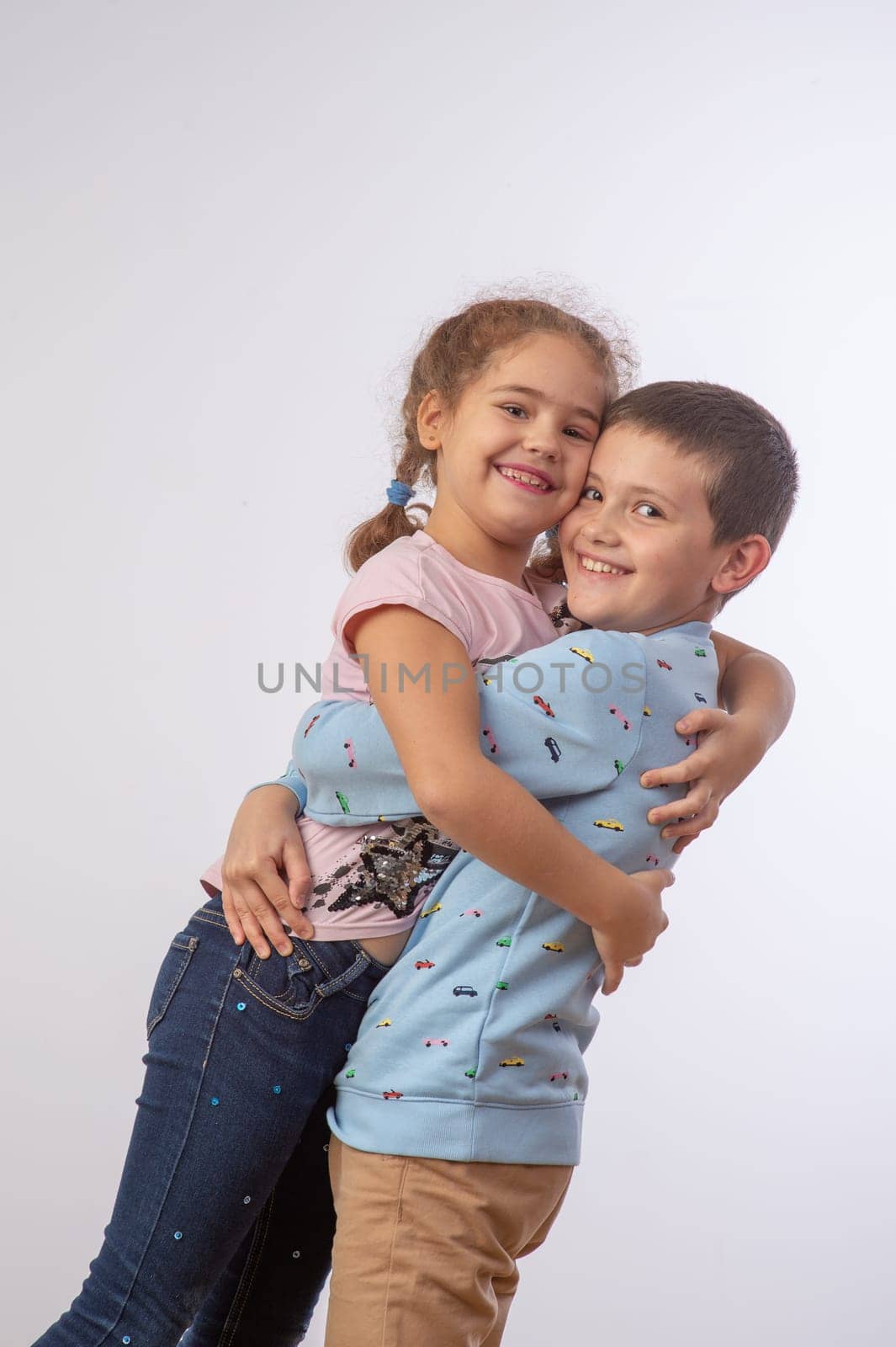 sister hugging brother studio portrait happy family 2 by Mixa74