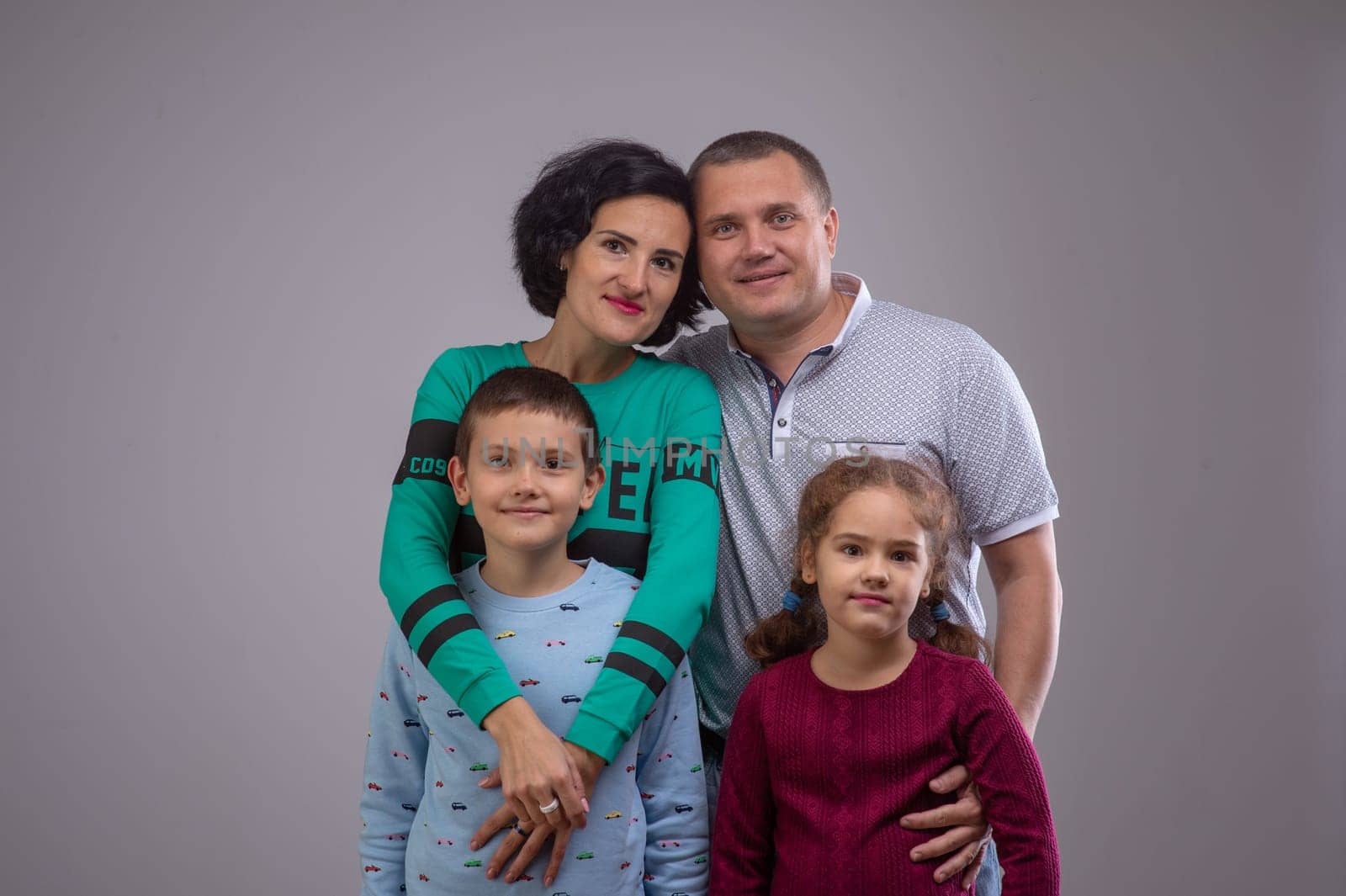 studio portrait of a happy family husband wife daughter and son 8 by Mixa74