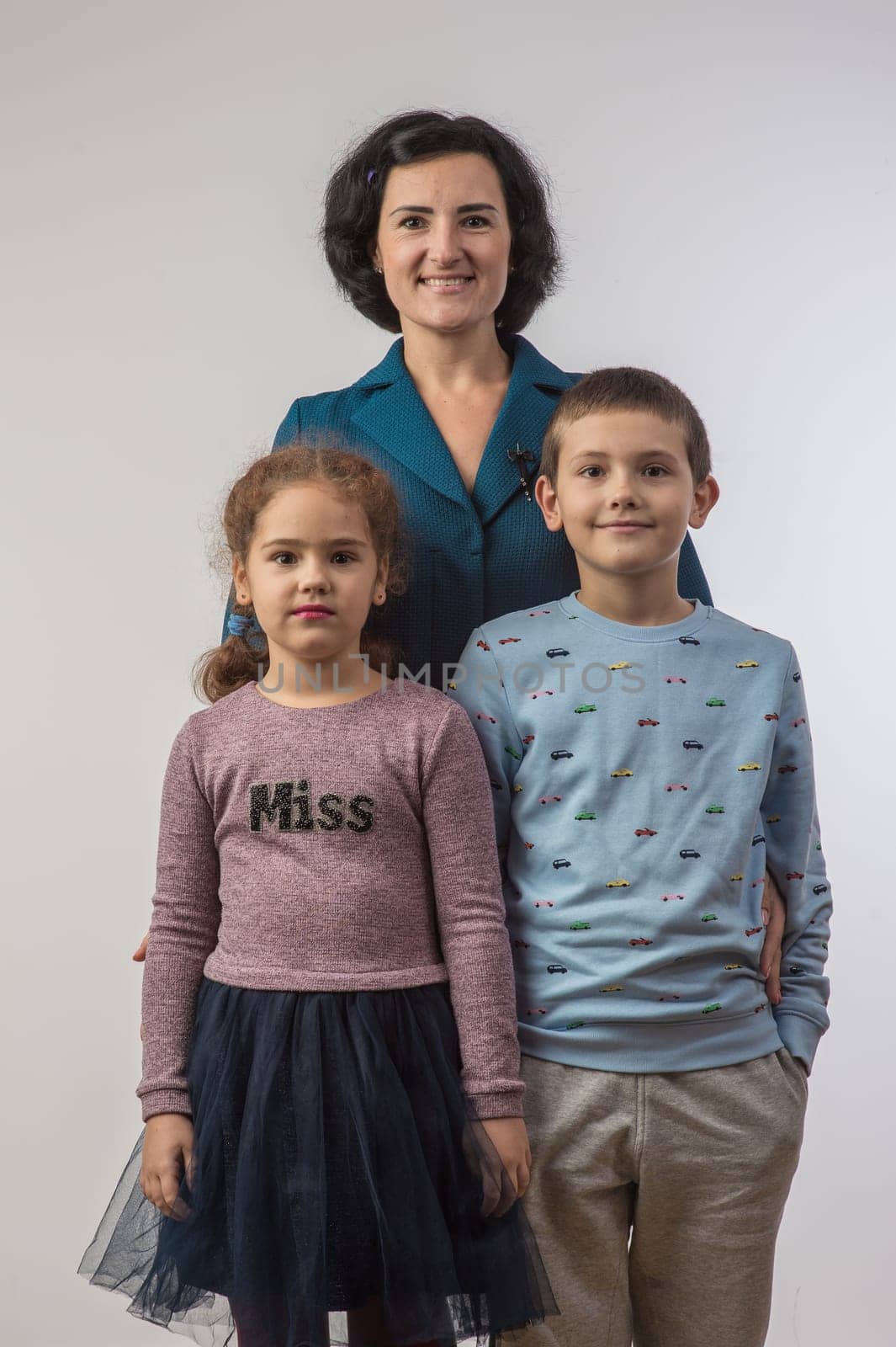 studio portrait of a happy family husband wife daughter and son 5
