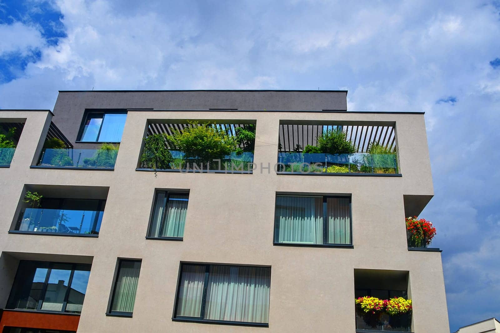 Uherske Hradiste, Czech Republic - July 13, 2018: Modern architecture. Urban terrace with flowers and greenery. Urban house.