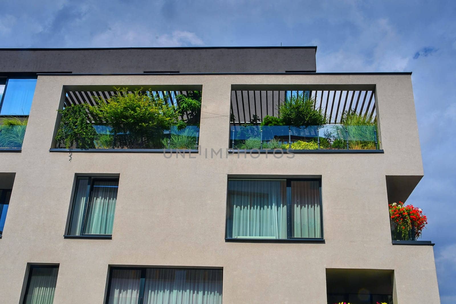 Uherske Hradiste, Czech Republic - July 13, 2018: Modern architecture. Urban terrace with flowers and greenery. Urban house.