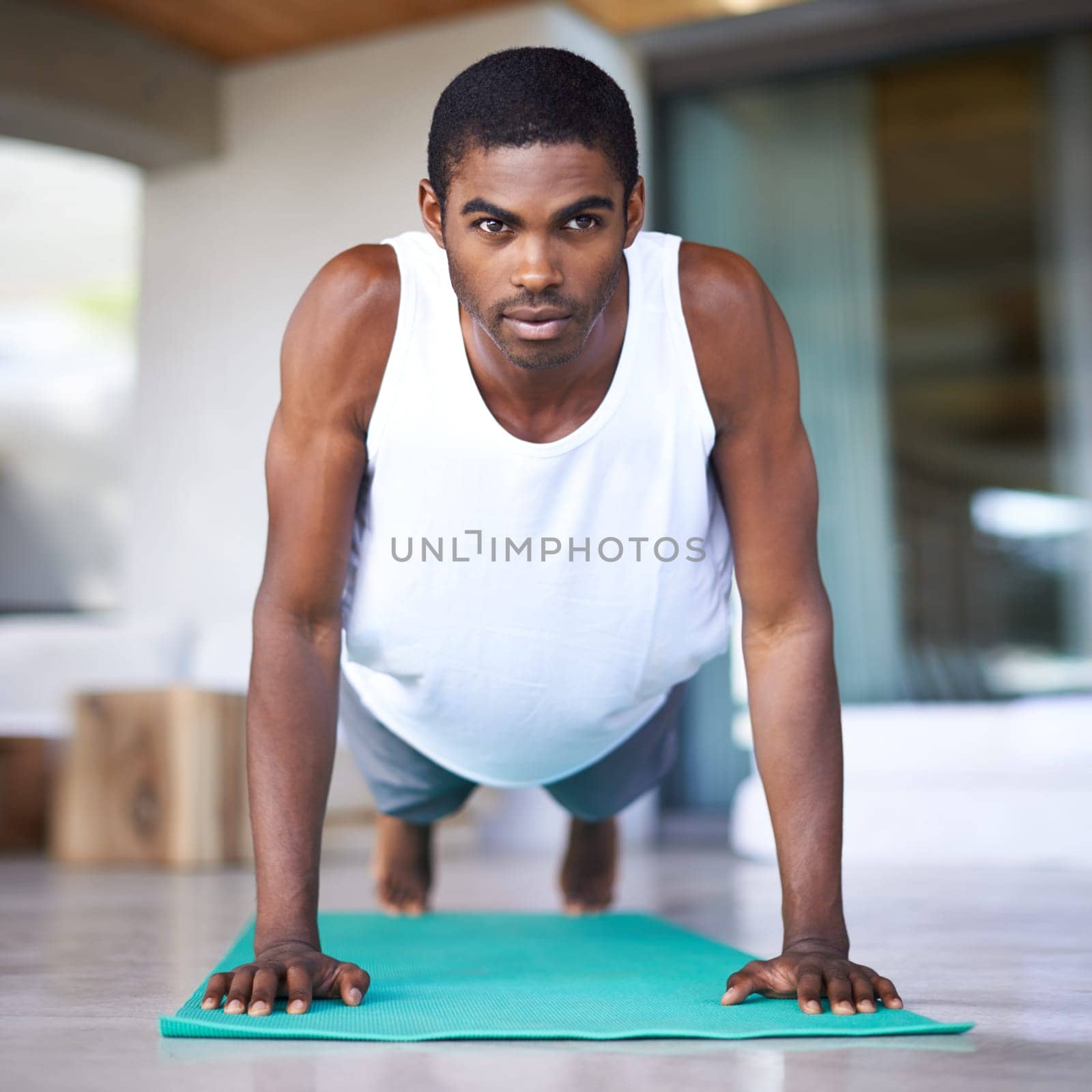 Fitness, yoga and portrait of black man in home for wellness, flexibility and balance for healthy body. Training, pilates and person on sports mat for stretching, workout and exercise in living room.