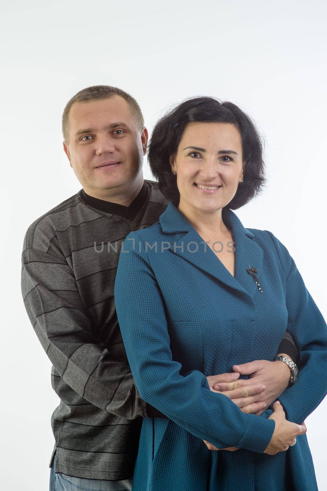 studio portrait of husband and wife happy family 2