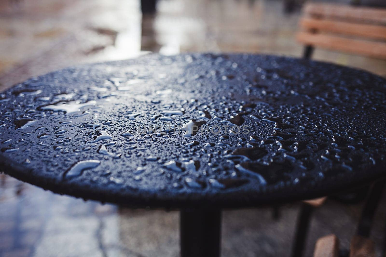 autumn rain drops on the table in a cafe