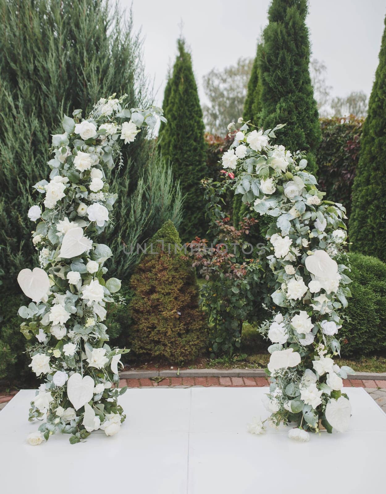 elegant wedding arch made of flowers. rich wedding decoration