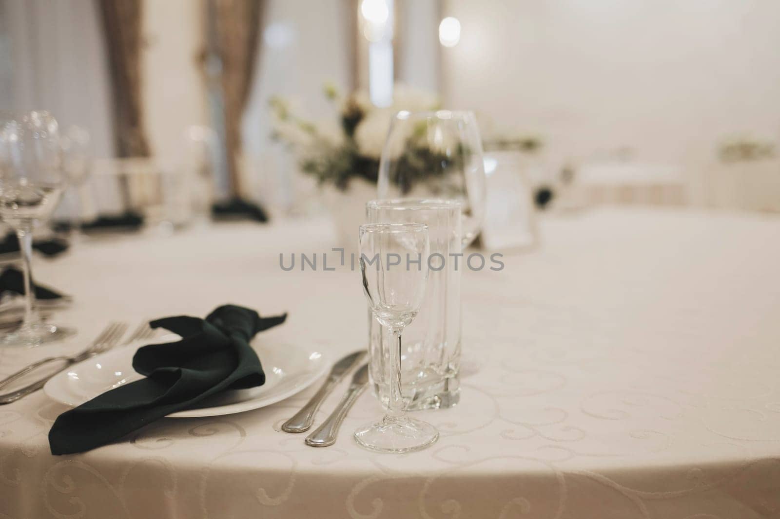 Beautiful table setting for wedding celebration in restaurant. wine glasses and cutlery