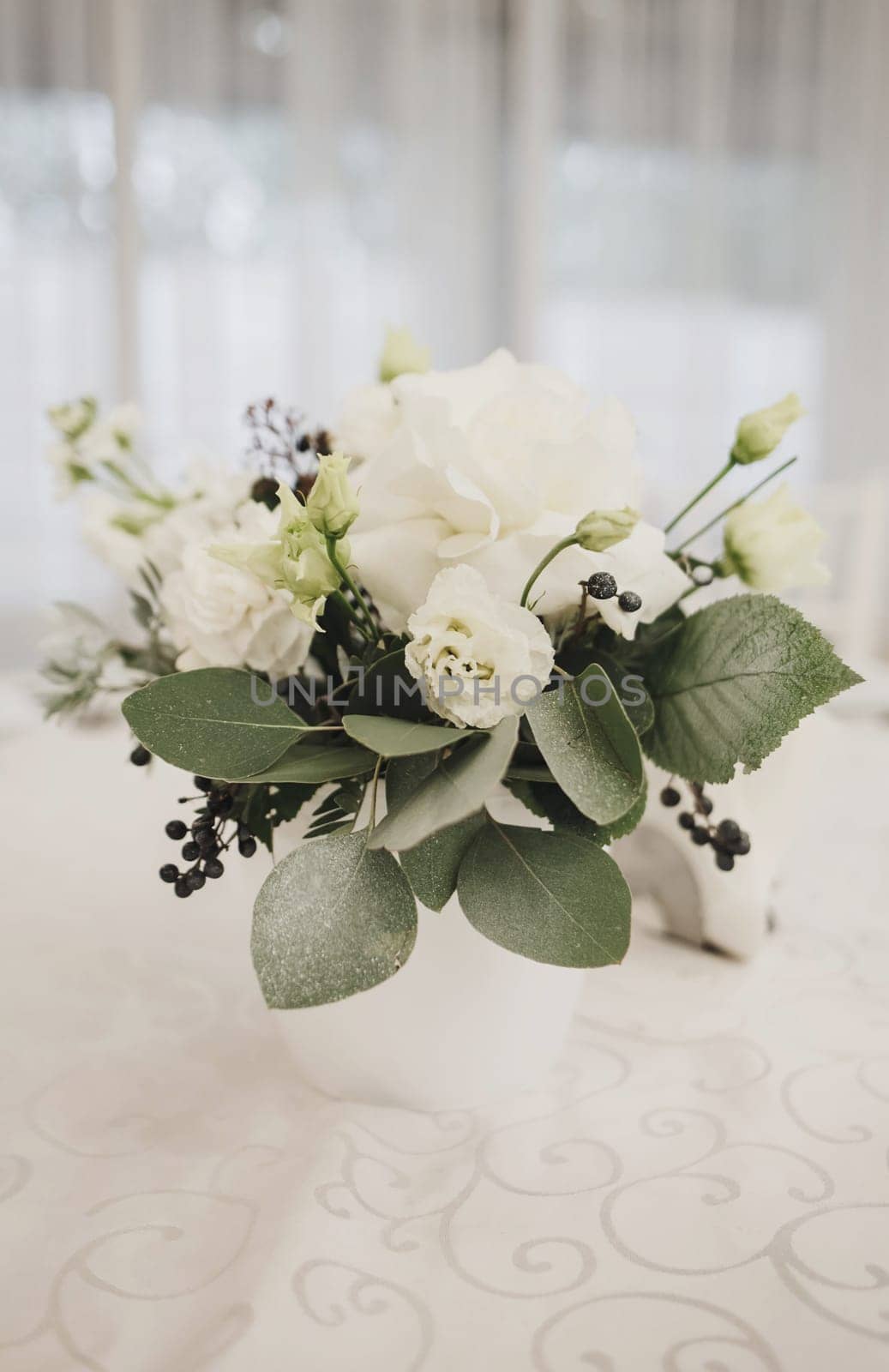 fresh bouquet of flowers on the wedding table. the decor of the restaurant