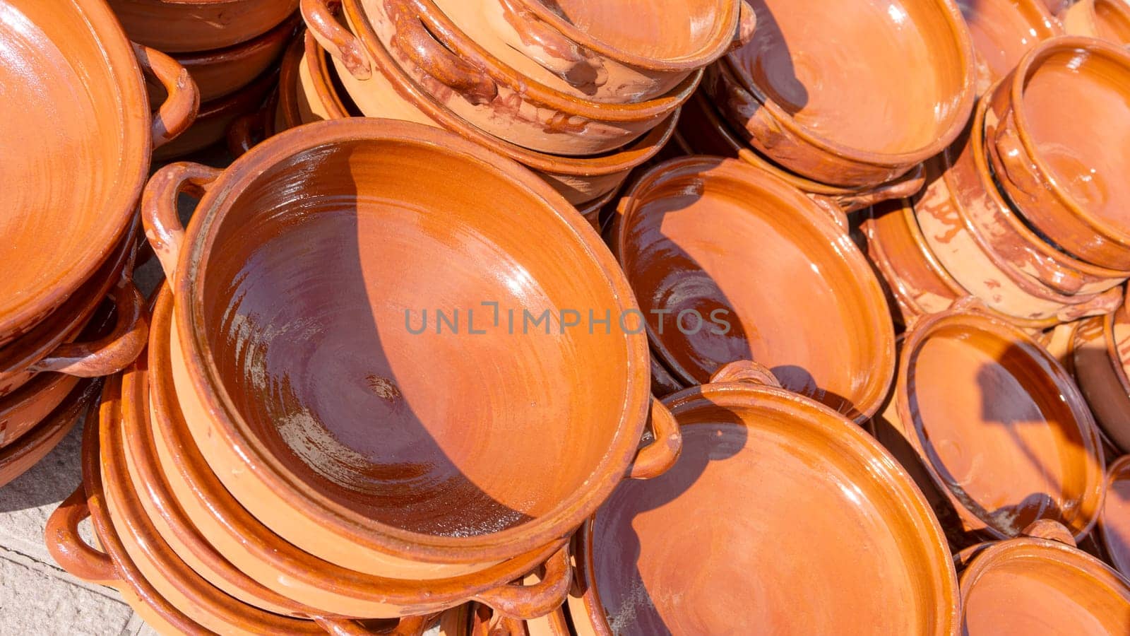 Sun-Kissed Terracotta Pottery, Stacked in Rustic Elegance by Juanjo39