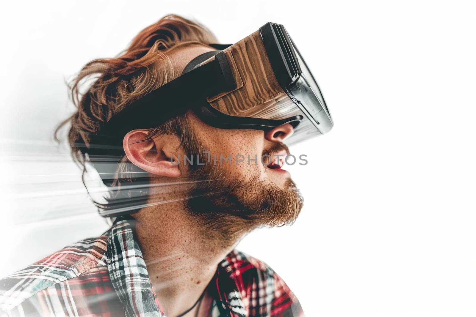 A man wearing a virtual reality headset. The man is wearing a red shirt and a plaid shirt