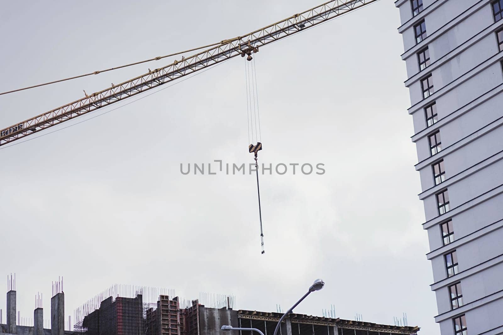 Construction site with crane on sky background. mortgage