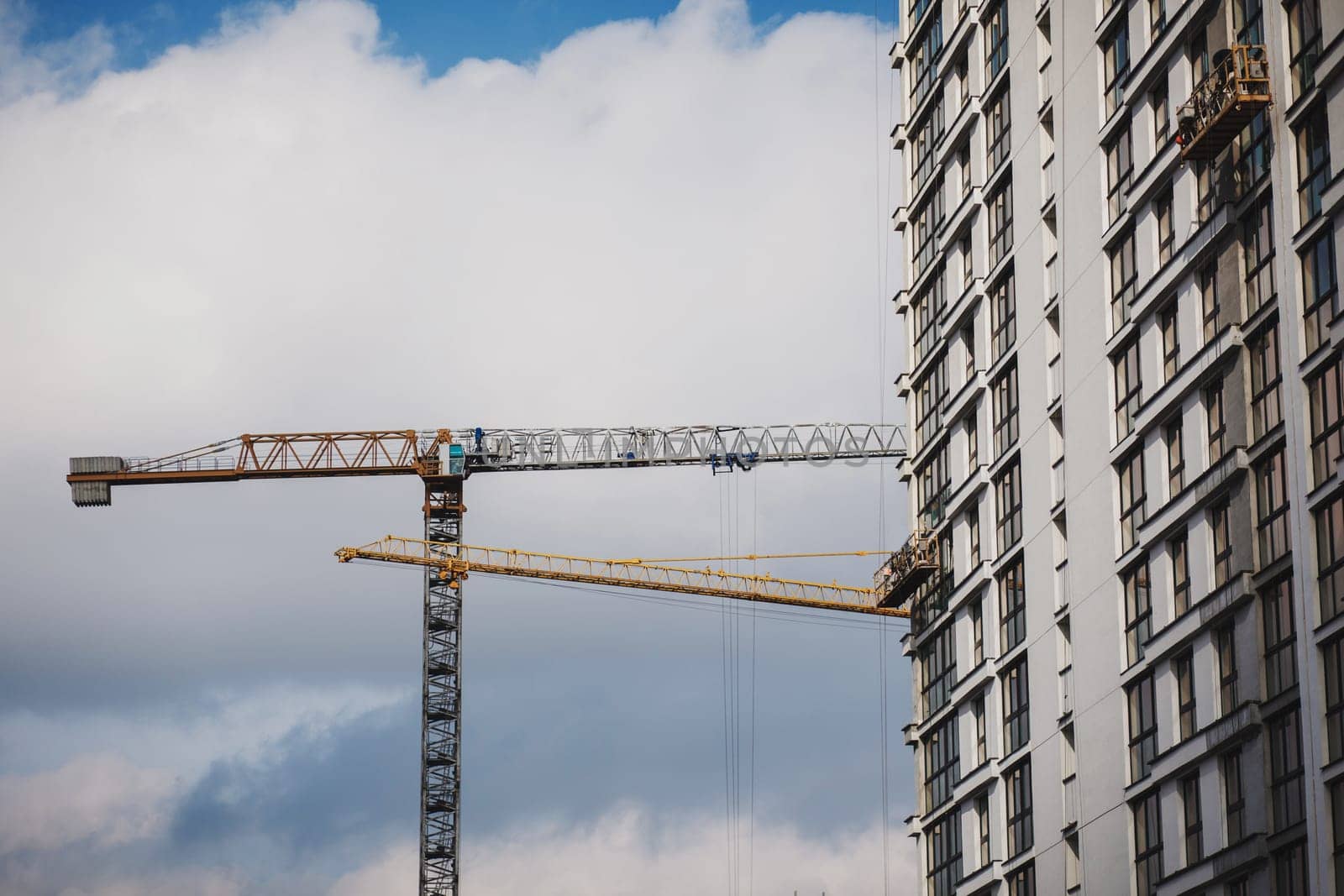 construction of a high-rise residential building . tower cranes in construction