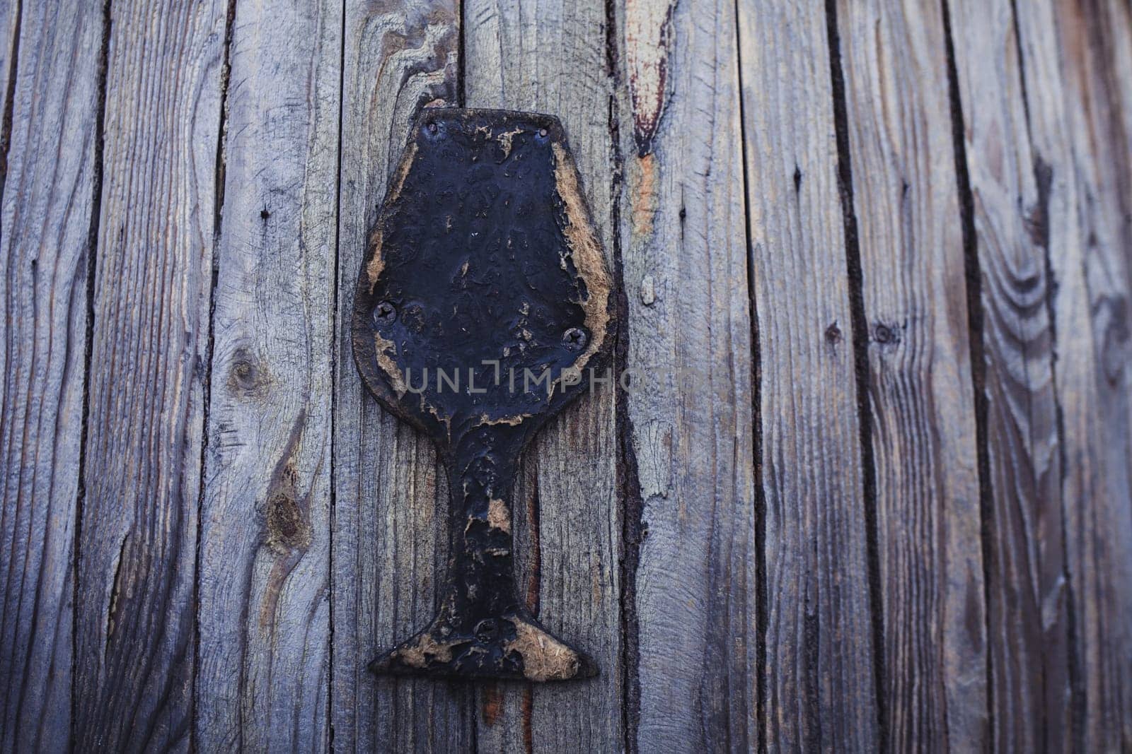 textured wood background with the image of a glass of wine