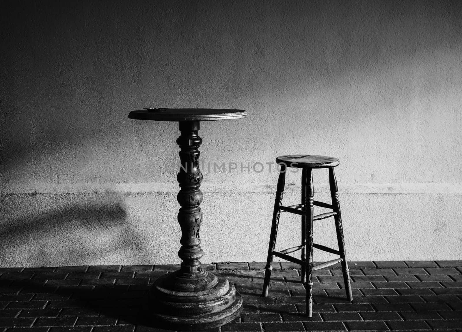 antique table and chair in the cafe. black and white photography