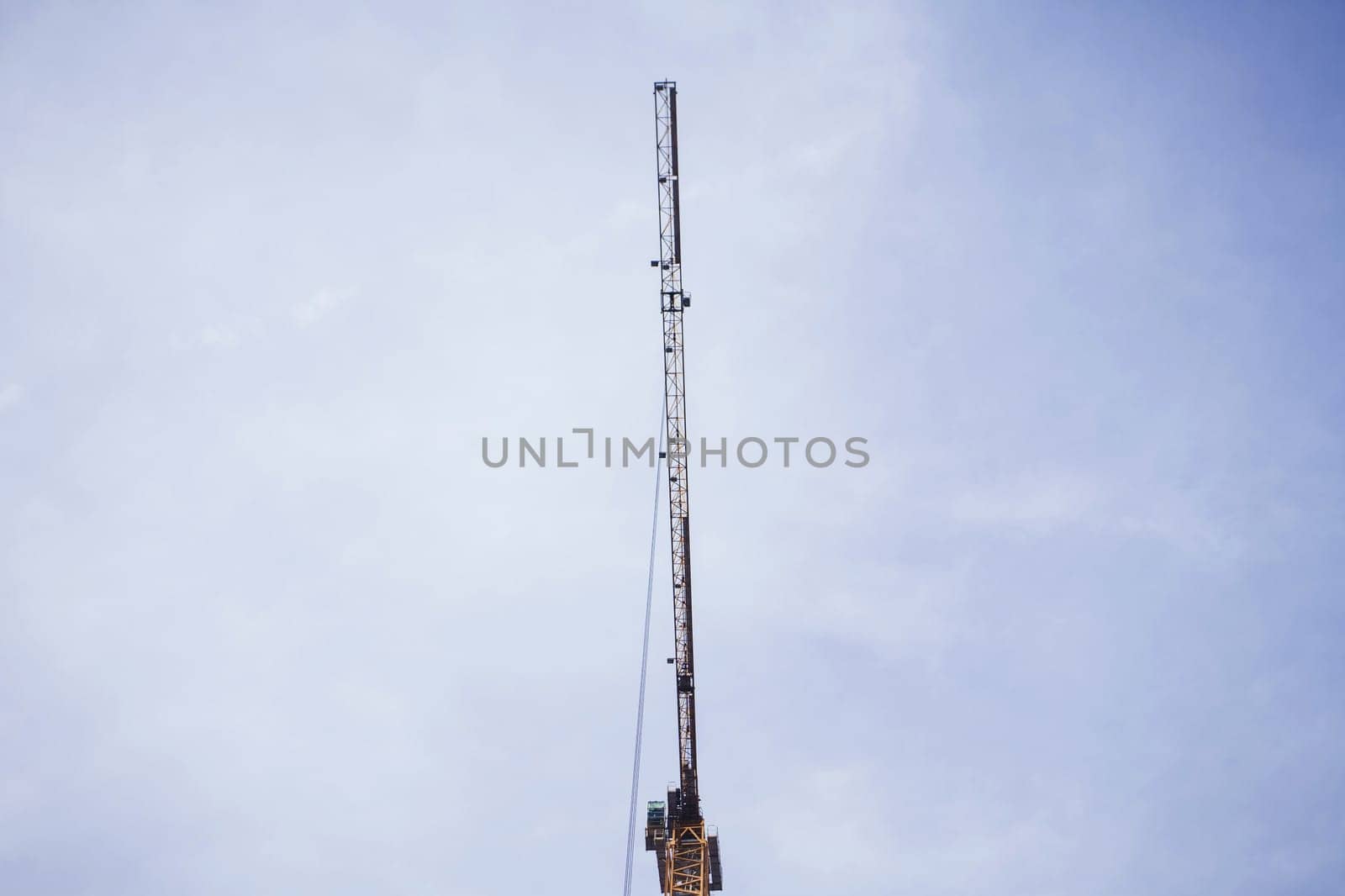 tower crane against the blue sky. copy space