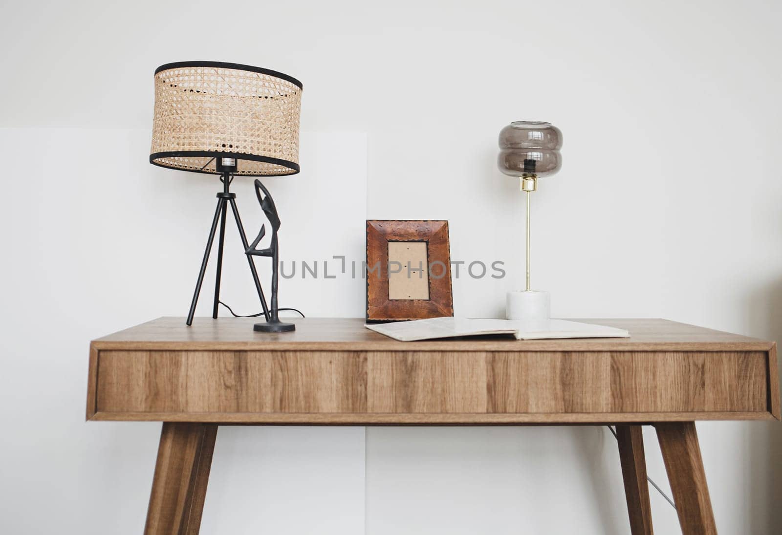 Wooden table with antique lamp in a classic interior