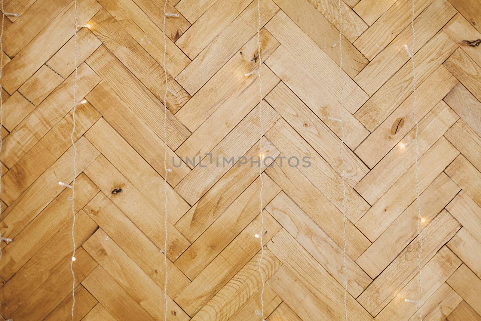 parquet wall texture. Christmas background with lights