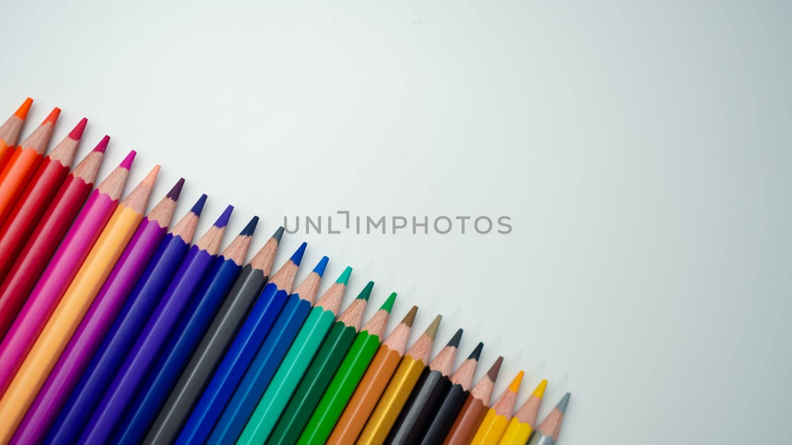 Set of colored pencils on a white background That is arranged in a bar graph, Color pencils on white background, Close up, seamless colored pencils row with wave on lower side, line pencils.