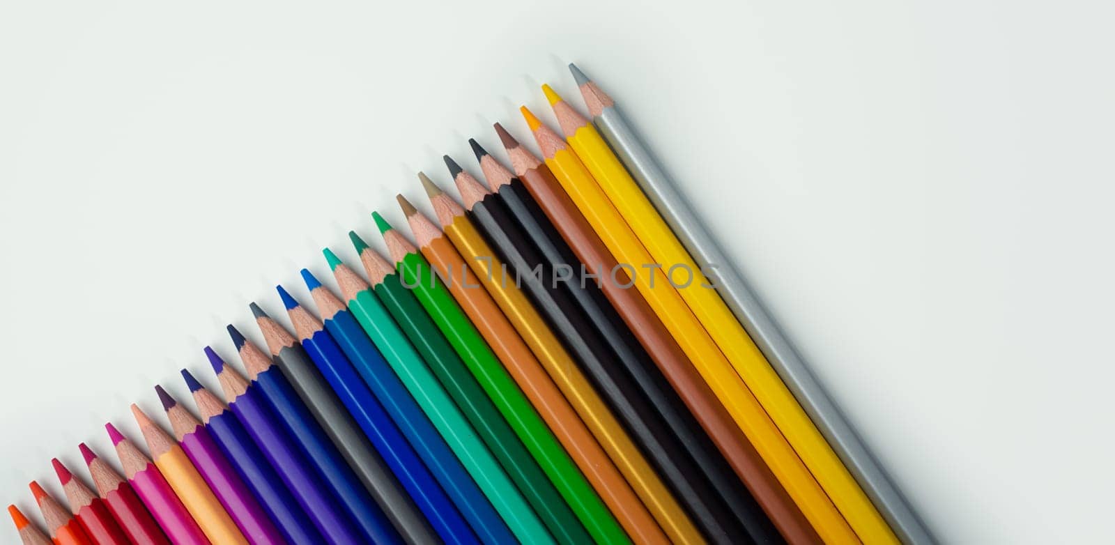Set of colored pencils on a white background That is arranged in a bar graph, Color pencils on white background, Close up, seamless colored pencils row with wave on lower side, line pencils. by Unimages2527