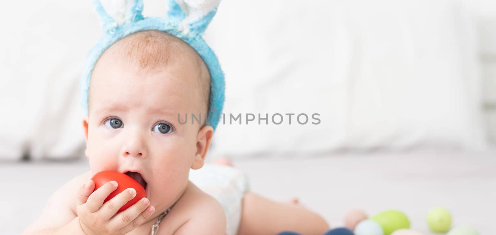 Newborn baby girl in a rabbit ears. Easter Holiday by Andelov13