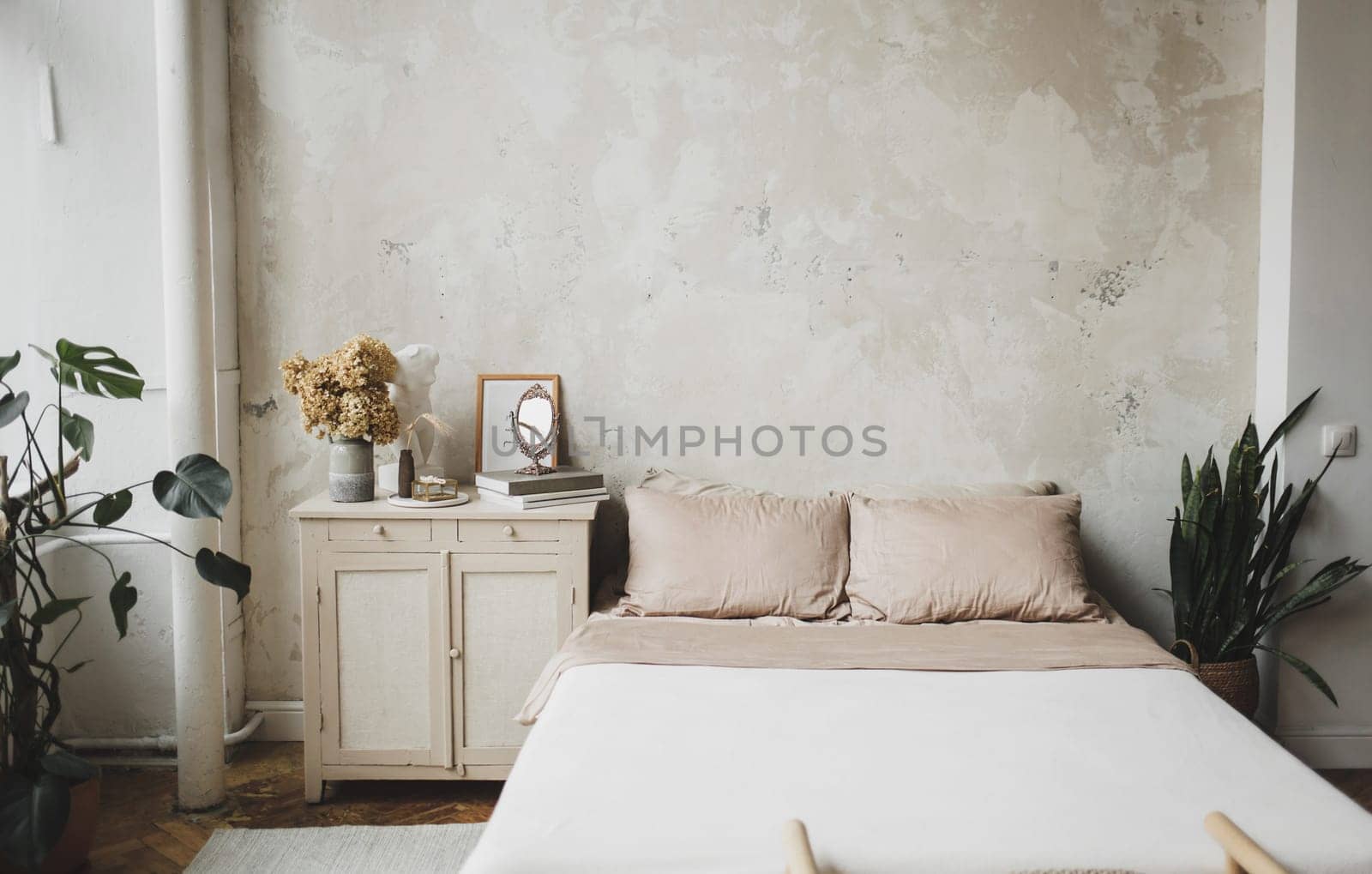 interior of a cozy bedroom in a modern minimalist design. Real photo of the hotel or room