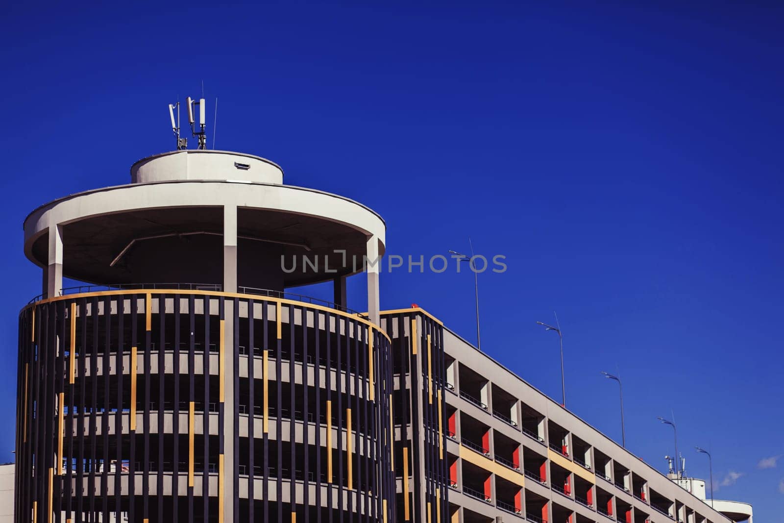 Modern colorful parking lot, round building exterior, abstract fragment