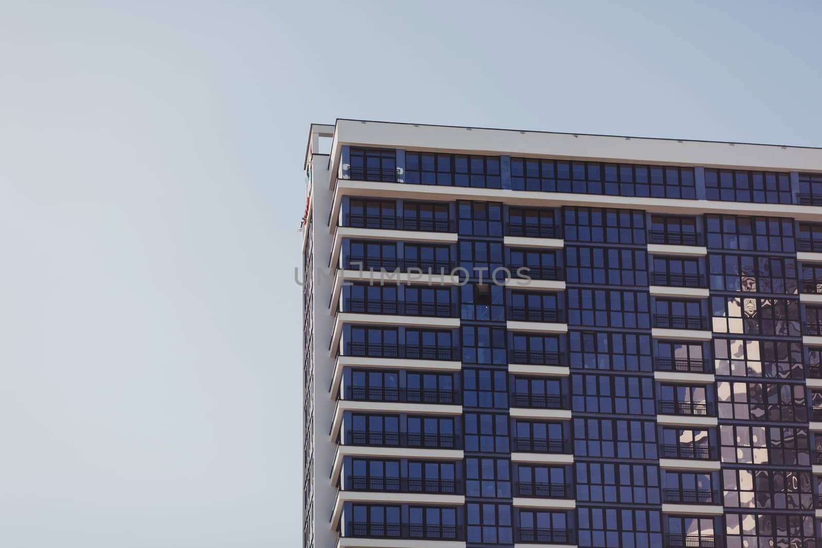 Fragment of Modern residential apartment with flat buildings exterior. Detail of New luxury house and home complex.