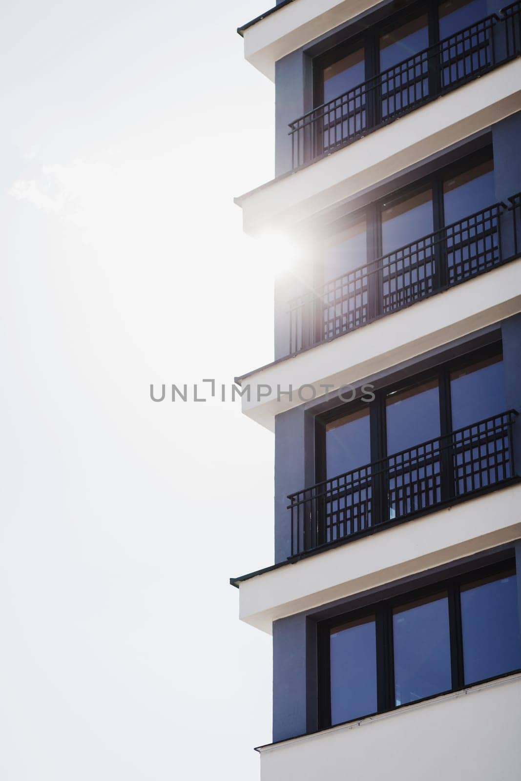 apartment buildings on a sunny day with a blue sky. Facade of a modern apartment building