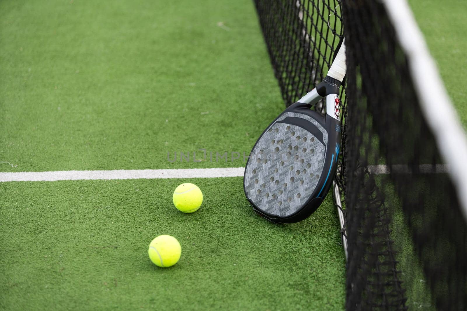 Paddle tennis racket and ball. High quality photo