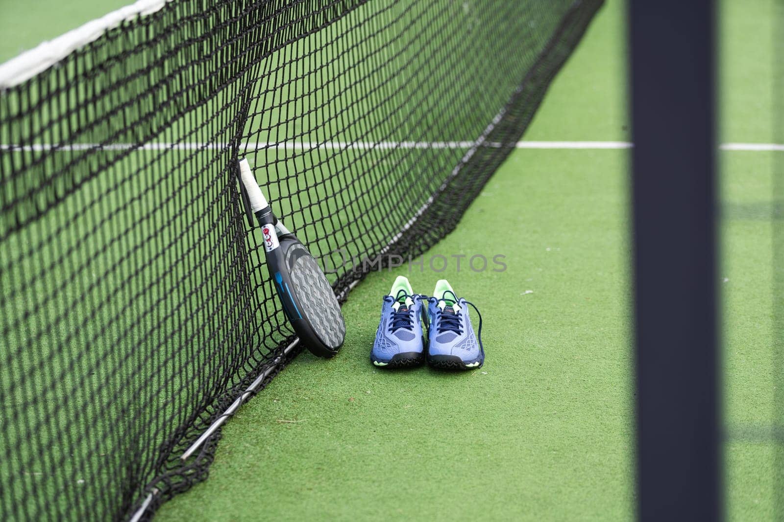 Paddle tennis objects and court. High quality photo