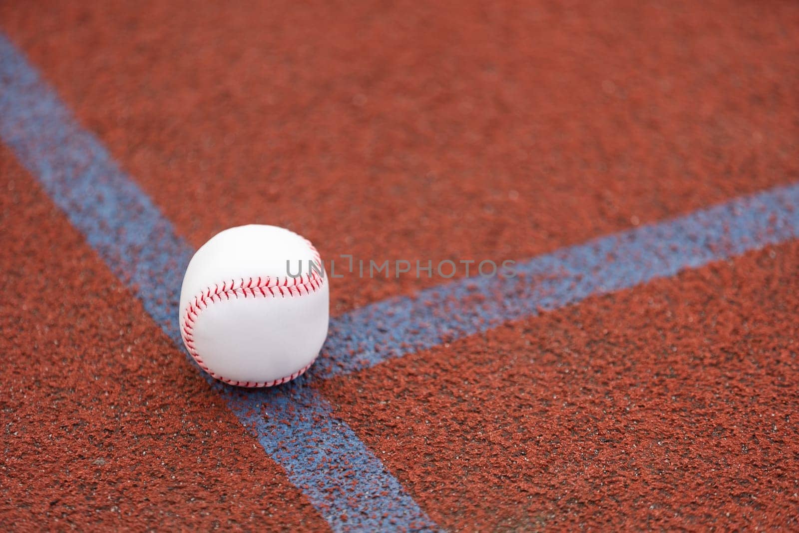 one baseball on infield of sport field by Andelov13
