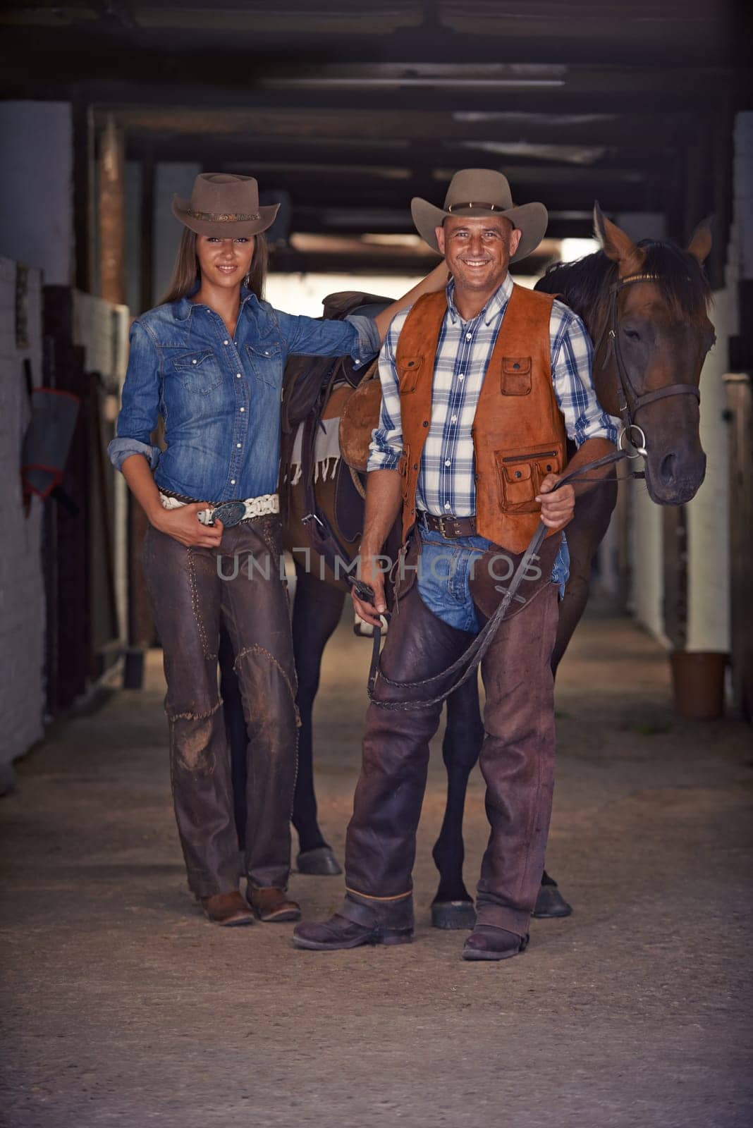Portrait, horse and couple in stable at farm in rural countryside for animal care in Texas. Smile, confident and full body of young man and woman with cowboy hats for fashion with stallion on ranch