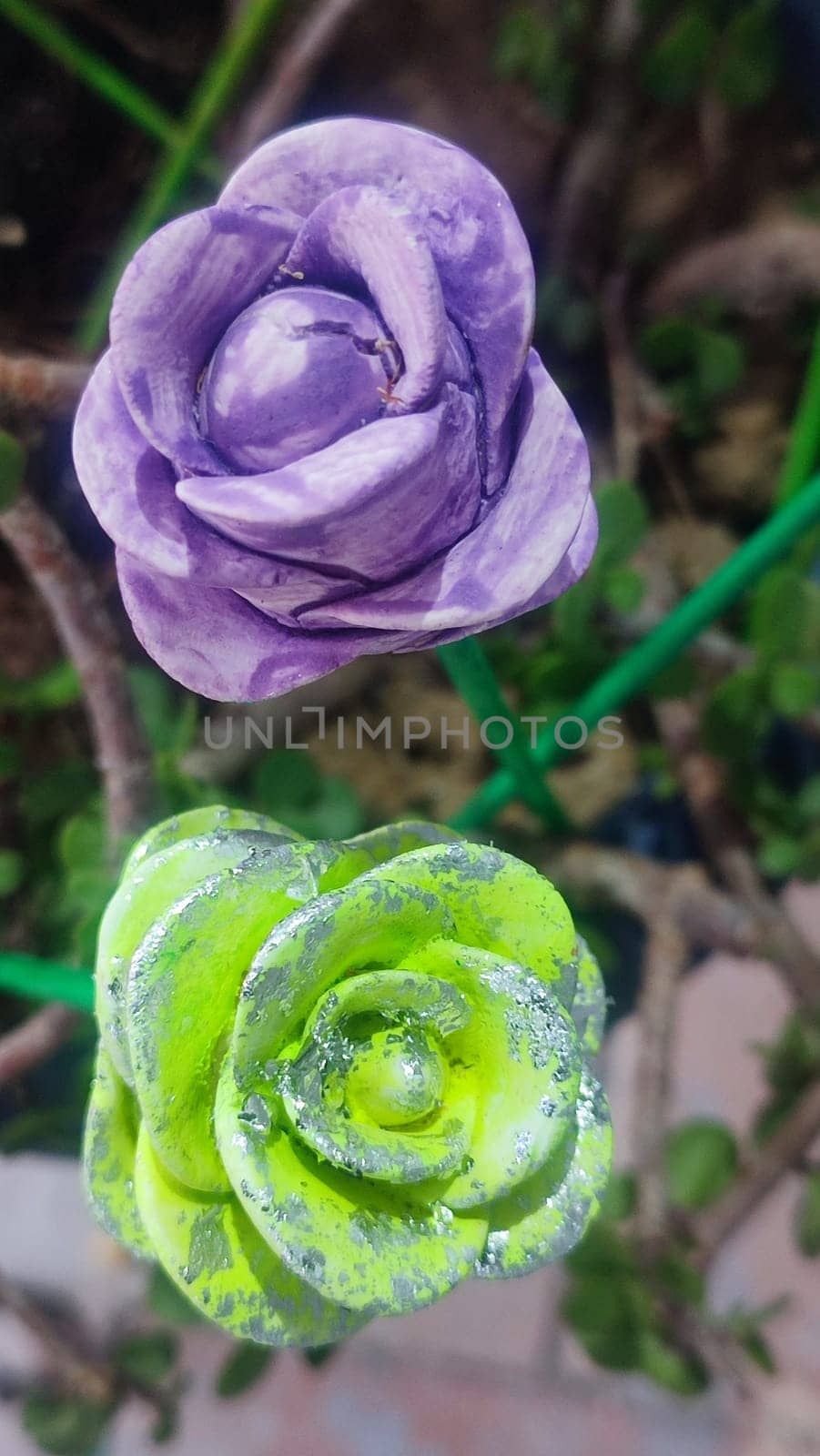 green and purple flowers, artificial roses art object bouquet interior. High quality photo
