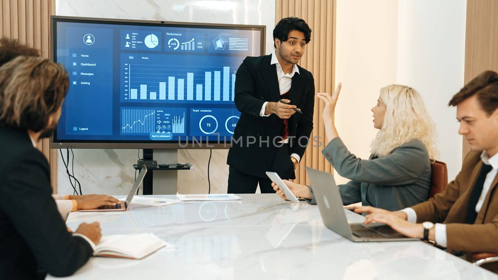 Presentation in office or ornament meeting room with analyst team utilize BI Fintech to analyze financial data. Businesspeople analyzing BI dashboard power display on TV screen for strategic planning