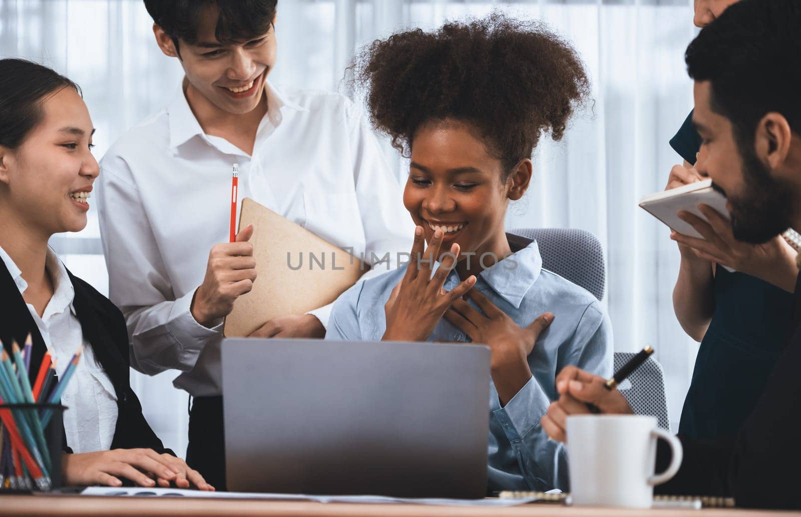 Happy diverse business people work together, discussing in corporate office. Professional and diversity teamwork discuss business plan on desk with laptop. Modern multicultural office worker. Concord