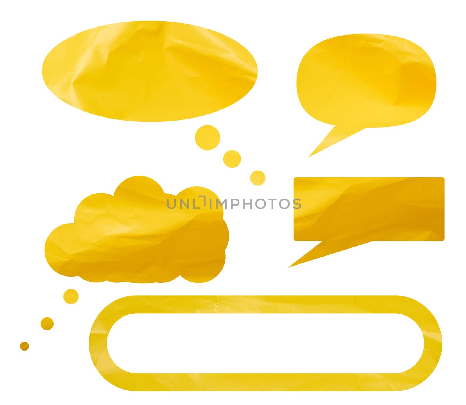Conversation clouds cut made of yellow crumpled polyethylen on isolated background, close up
