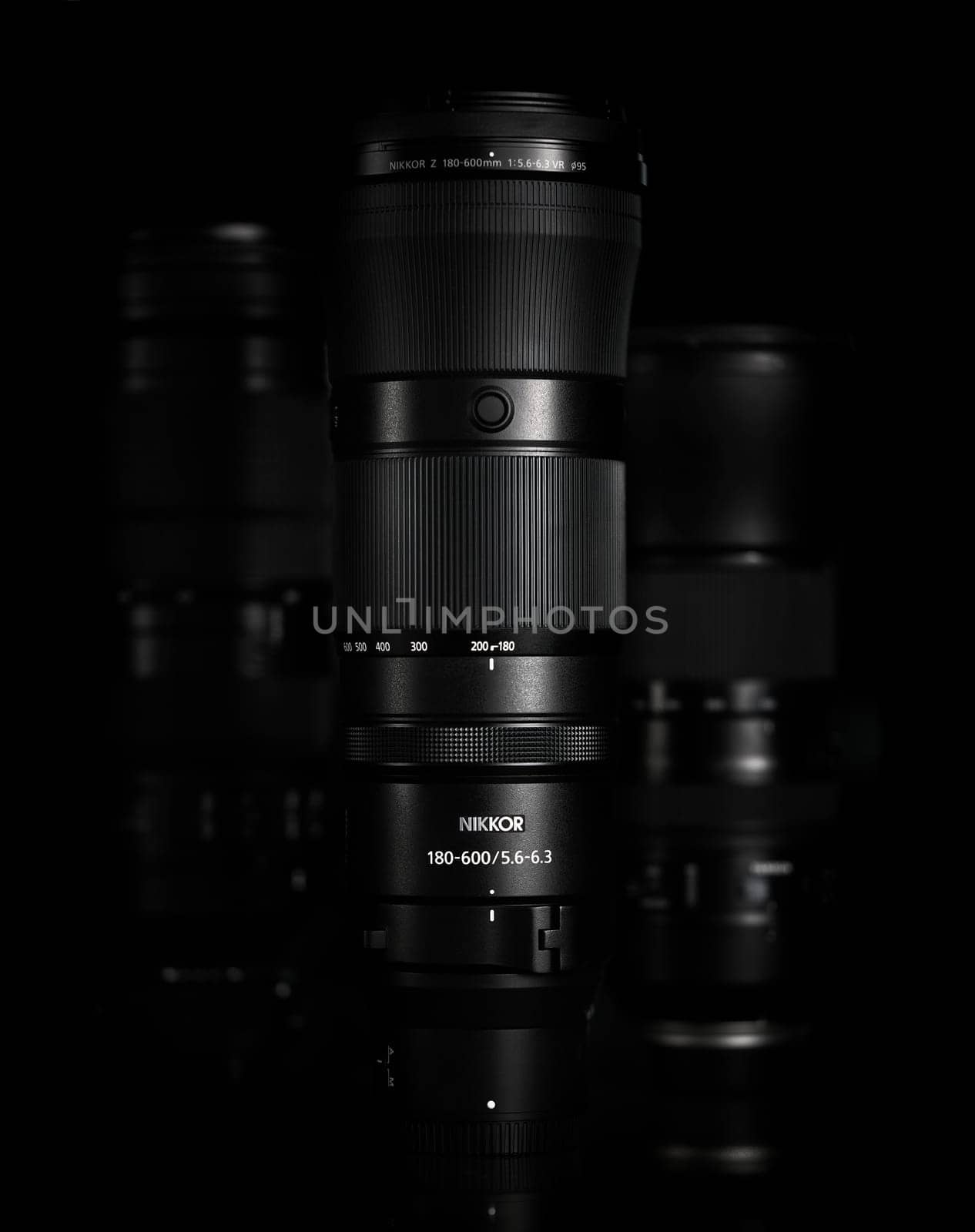 Super telephoto lenses on a black background. The NIKKOR Z 180-600mm f 5.6-6.3 VR in the foreground. Professional photo and video optical lenses for digital camera. 20.02.2024, Yerevan, Armenia